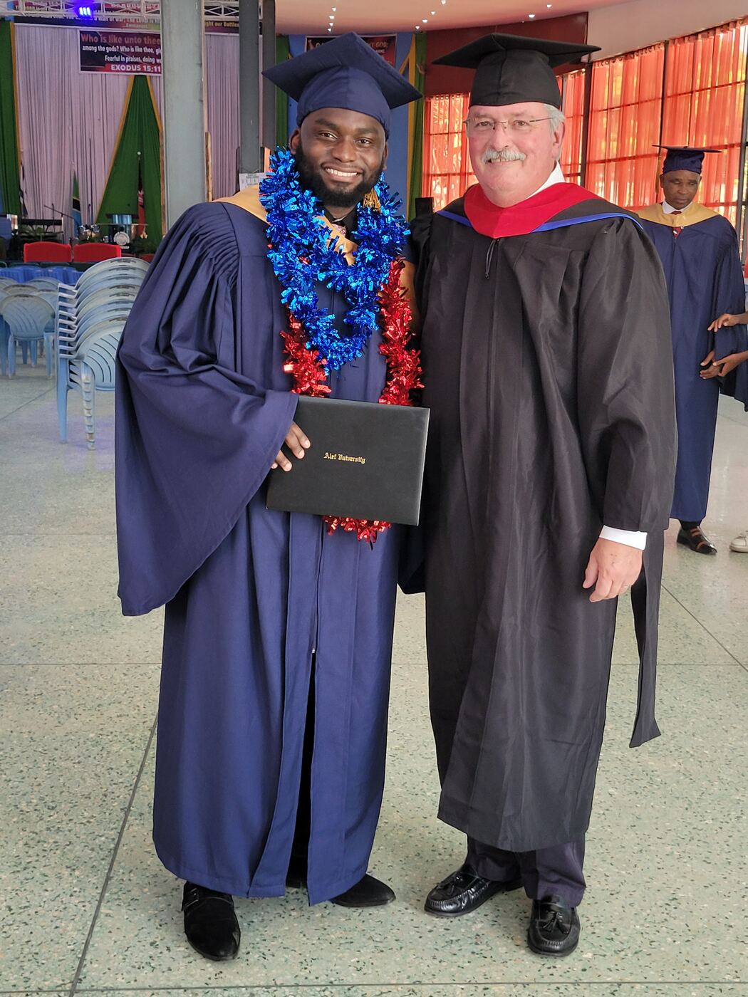 Professor Mike with an Alef University graduate
