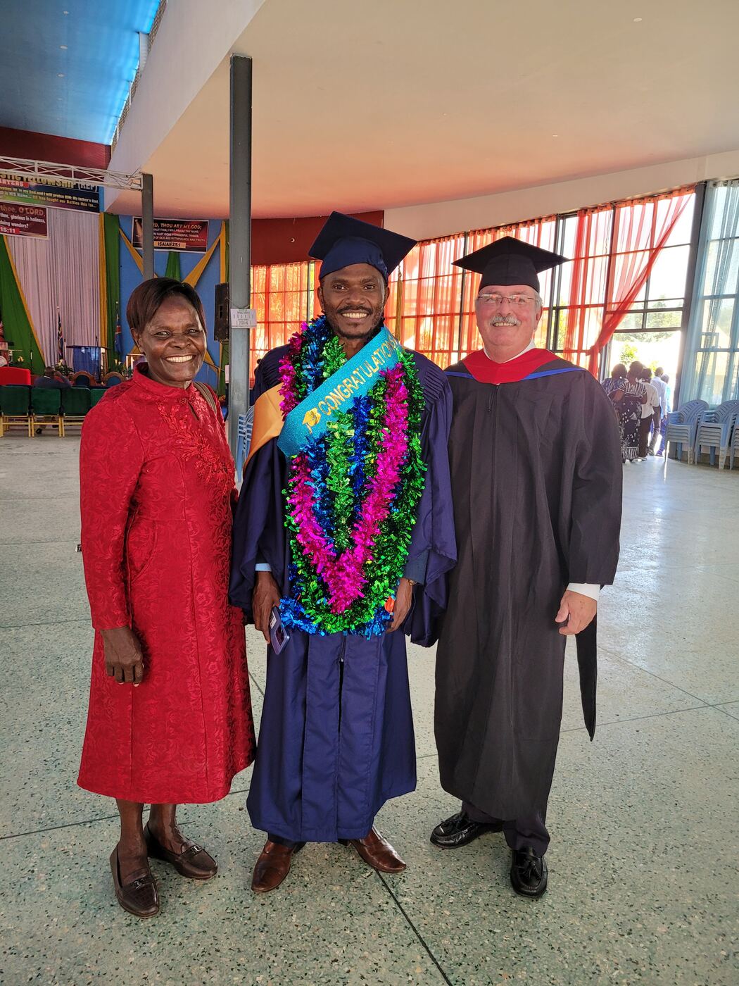 Pastor Allan Kiptangus with his mother and Professor Mike